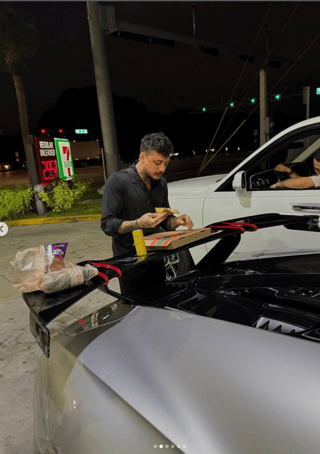 Raul enjoying pizza at gas station